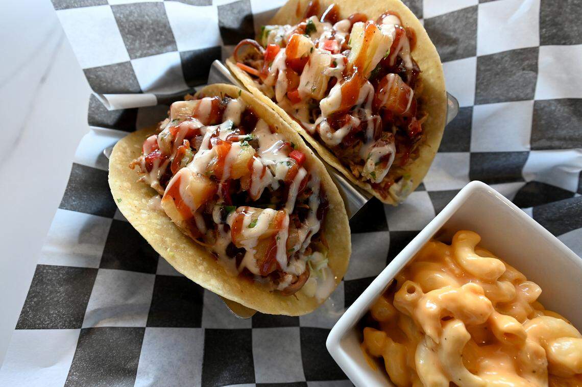 Island tacos with pulled pork, cole slaw, bbq sauce, southwest sauce, pineapple salsa on either corn or flour tortillas at Pork Belly’s, 9516 Cortez Road West.