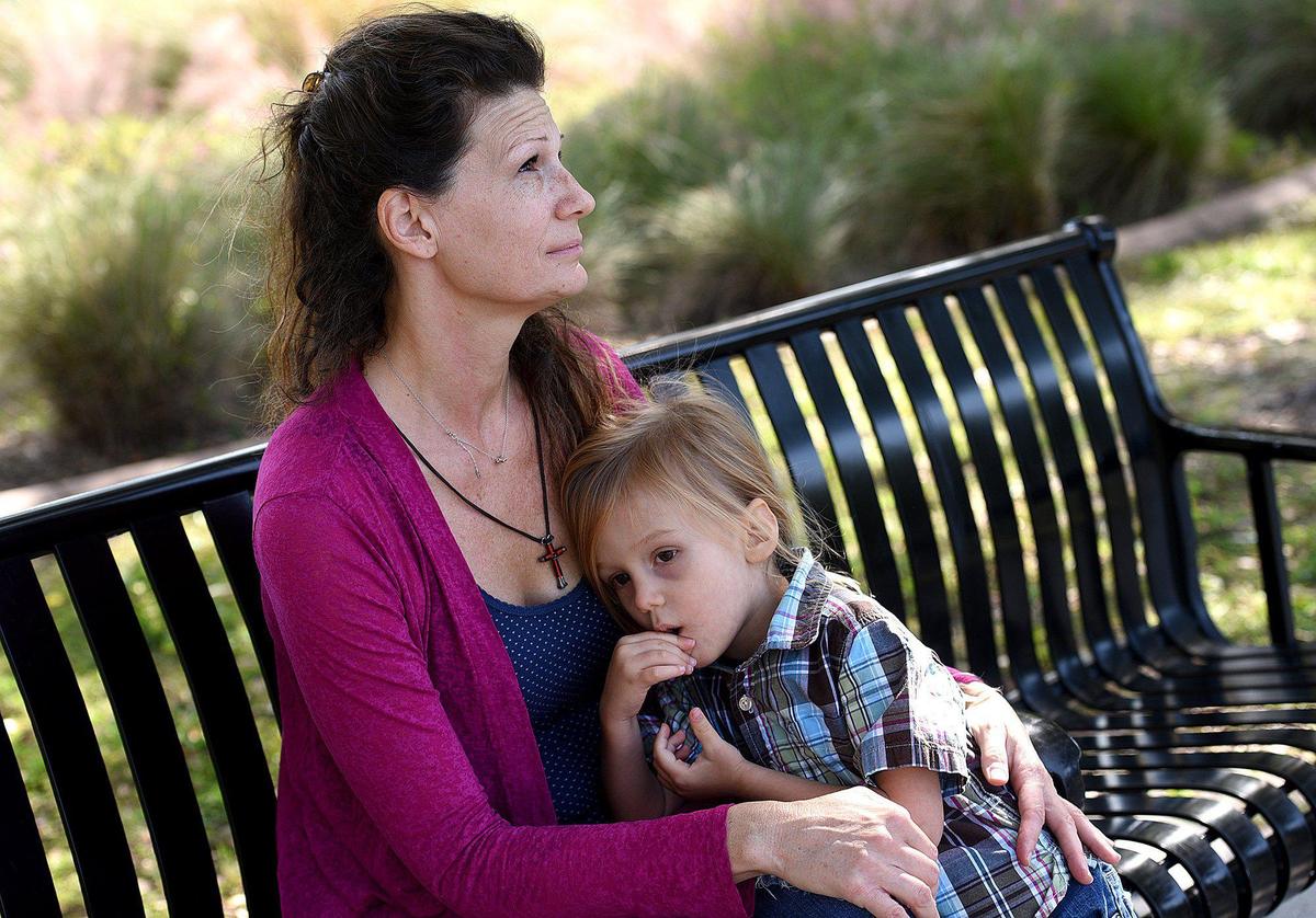 DeAdra Sunset and her almost-four-year old son, Dacian, play at Riverwalk. DeAdra left an abusive relationship to start over in Bradenton with her son.