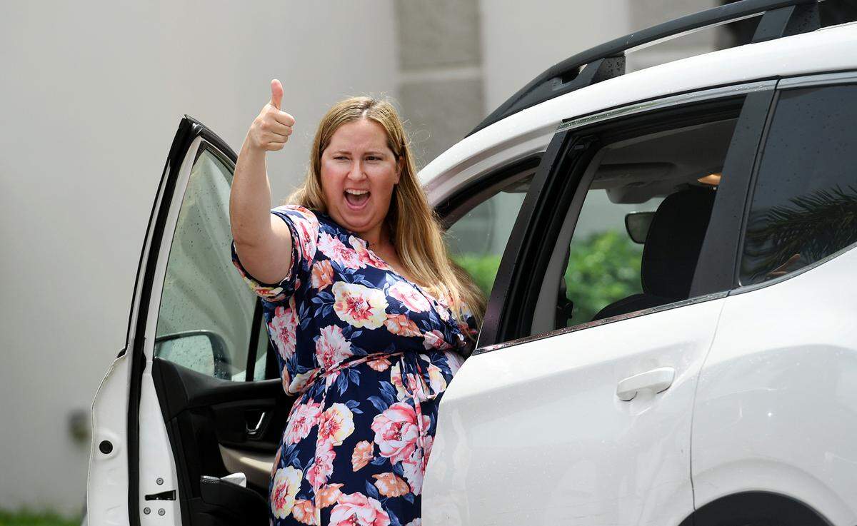 A motorist shows support for March For Our Futures, an anti-gun violence march and rally organized by Women’s Voices of Southwest Florida, marches from the Riverwalk splash park to Bradenton’s Historic Courthouse.