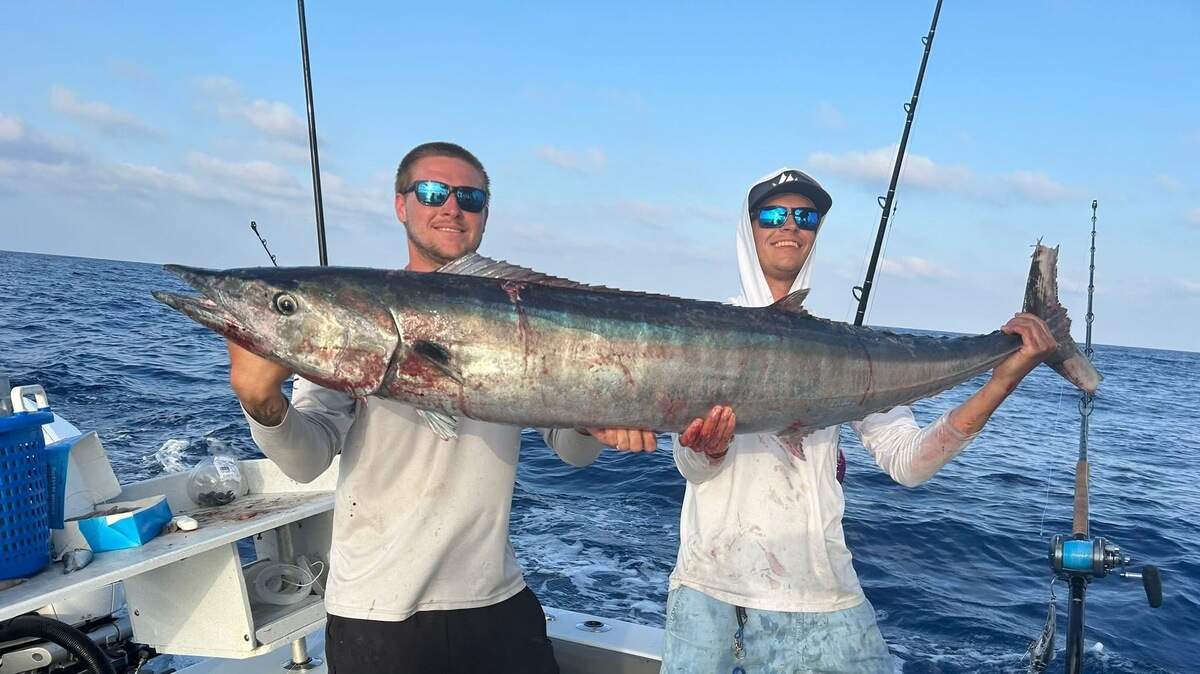 Captain Tyler DeGraff and Captain RJ Cox pose with their 62-pound wahoo caught during last weekend’s Boca Grande Bottom Blast.