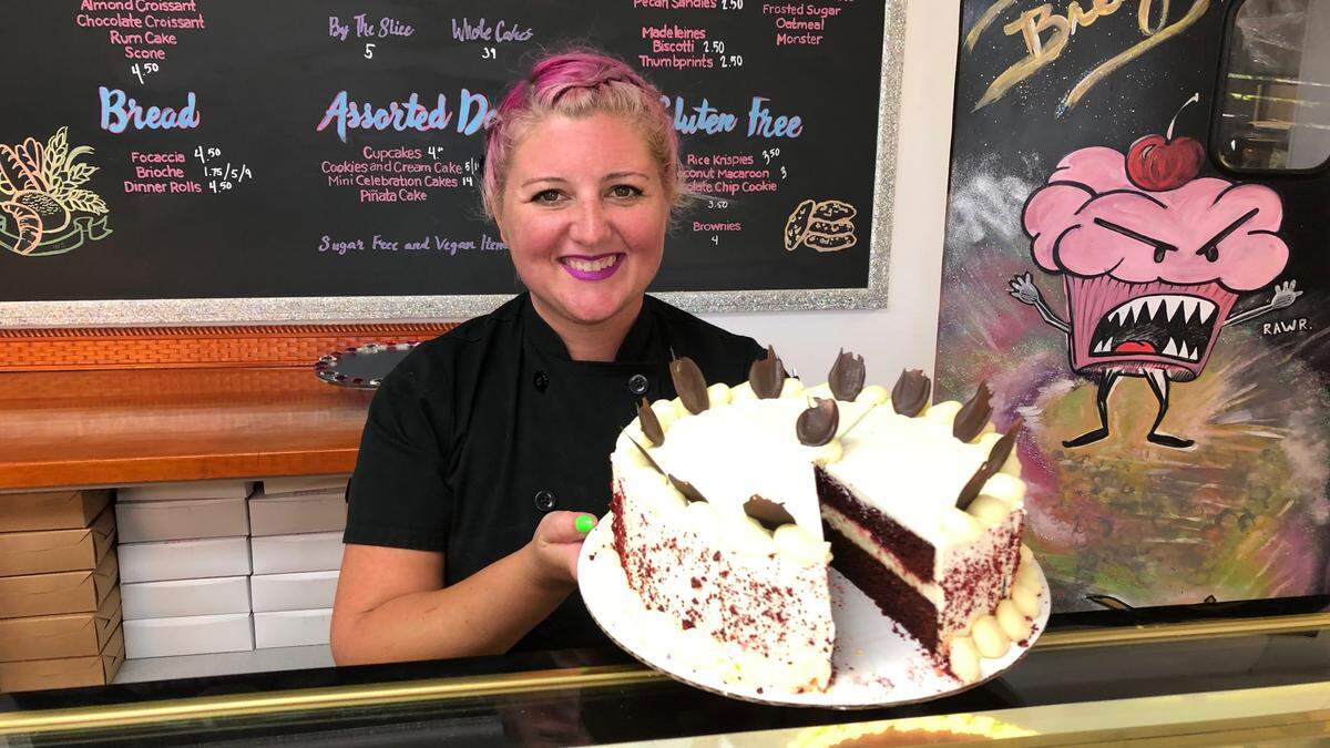 4/29/2021-- Breezy Bakery recently opened at 11904 Cortez Road W., near Tyler’s Ice Cream. Bri Suzano is shown with a red velvet cake.