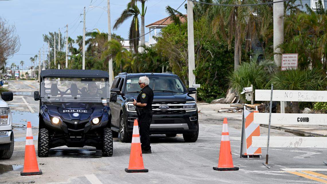 A checkpoint at the entrance to Holmes Beach stops those trying to enter the town from Bradenton Beach after Hurricane Milton on Anna Maria Island on Oct. 11, 2024.