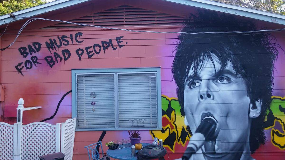 Jerk Dog Records has been selling vinyl in Village of the Arts since 2014. Local street artist Richard Brasil recently completed a mural featuring punk rocker Lux Interior of The Cramps on an exterior wall of the shop.