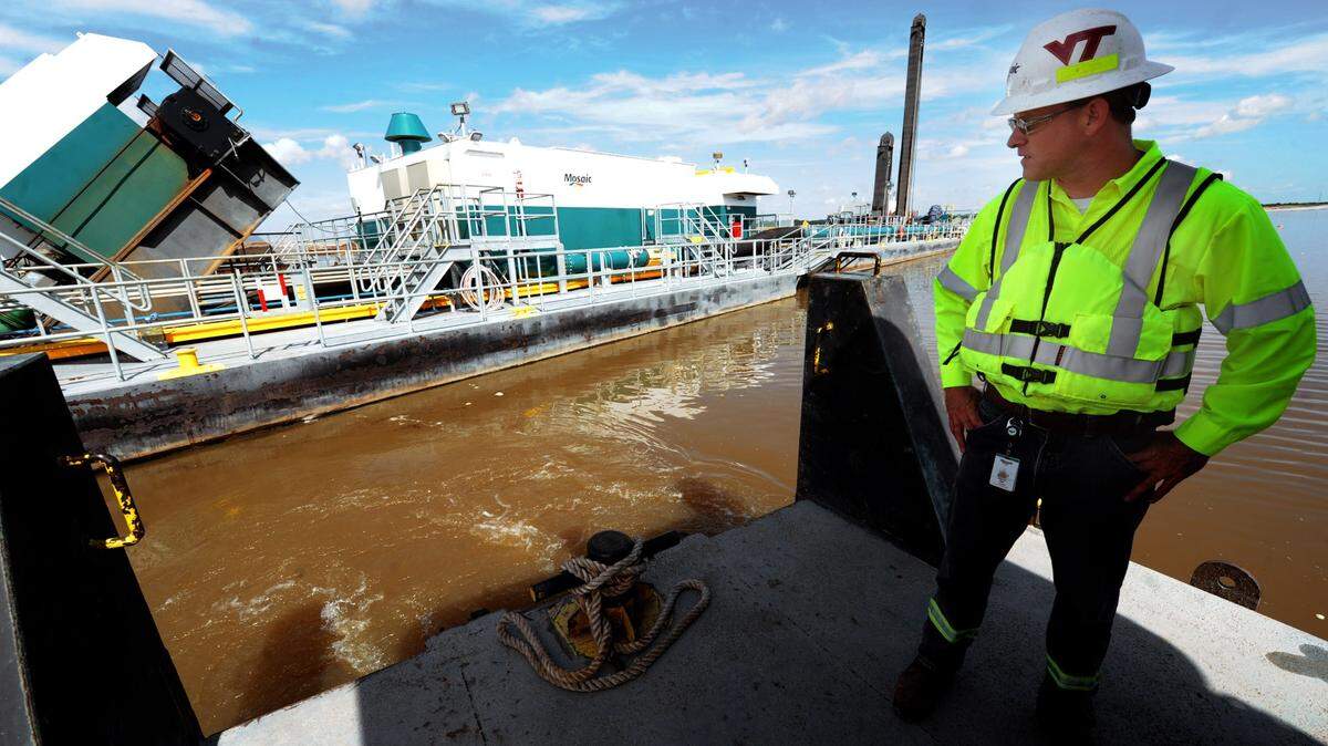 Brian Ball, the general manager of the Wingate Creek Mine at the time, looks out over a dredge as it mines phosphate at the Mosaic Wingate Creek Mine in East Manatee County in 2015.