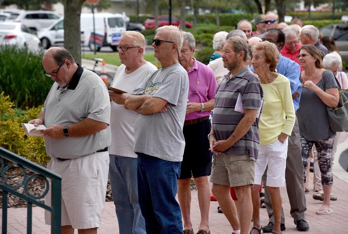 Voters line up outside the Lakewood Ranch Town Hall for the first day of early voting Wednesday morning.
