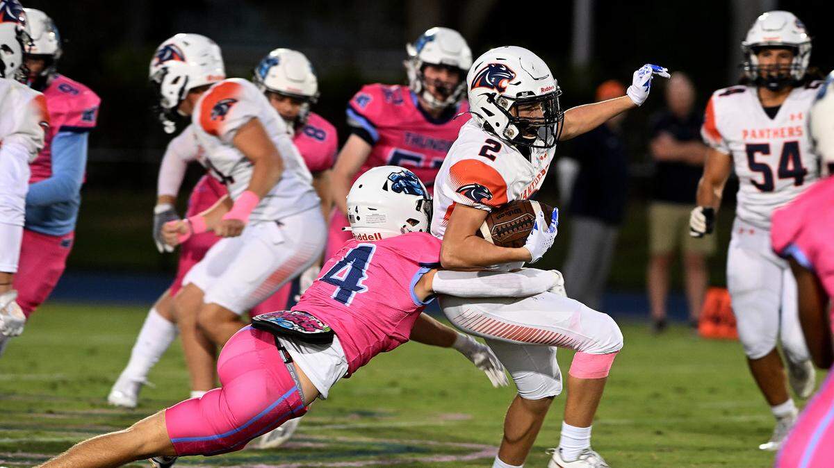 BCS’ Colton Dempsey runs the ball as ODA’s Jack Meyers tries to halt him at the Out of Door Academy field on Friday, Oct. 20, 2023.