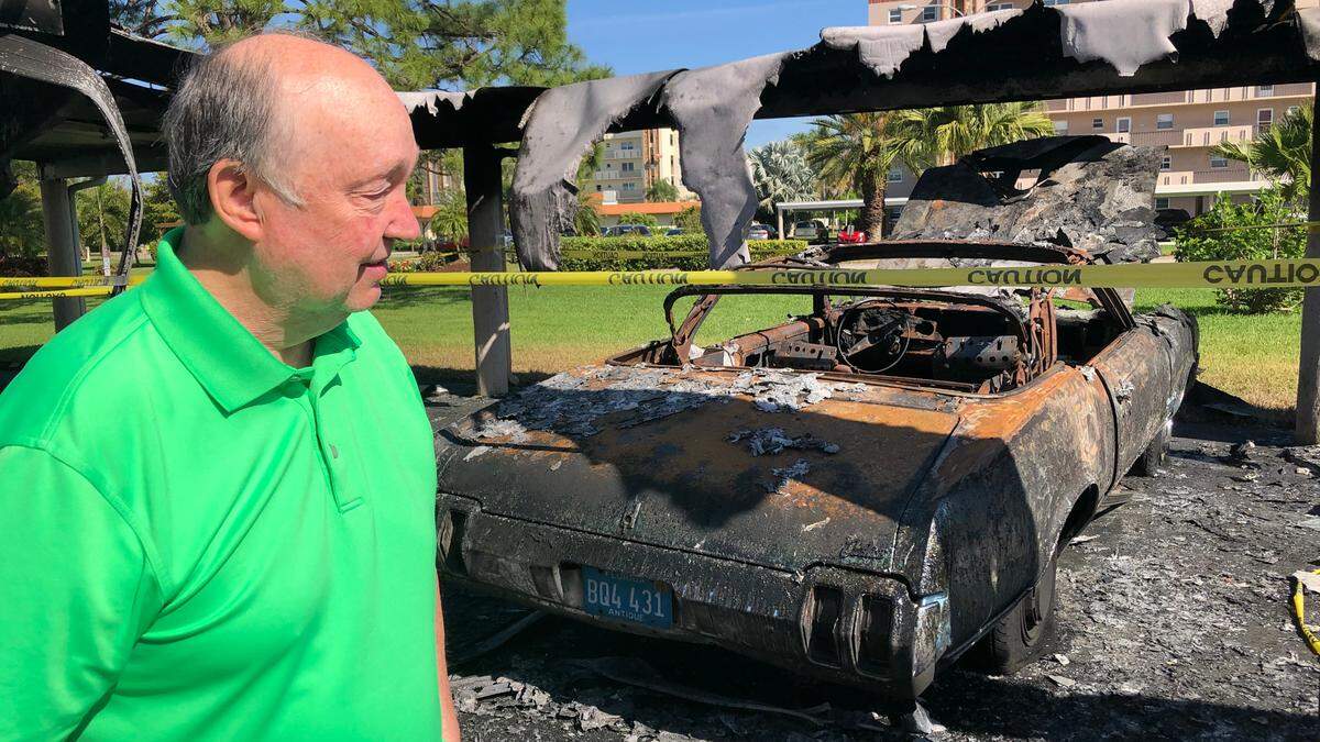 3/16/2021--Patrick Guinan looks at the charred remains of his 1970 Olds Cutlass. Guinan owned the car for 5 years and nicknamed it ‘Old Blue.’