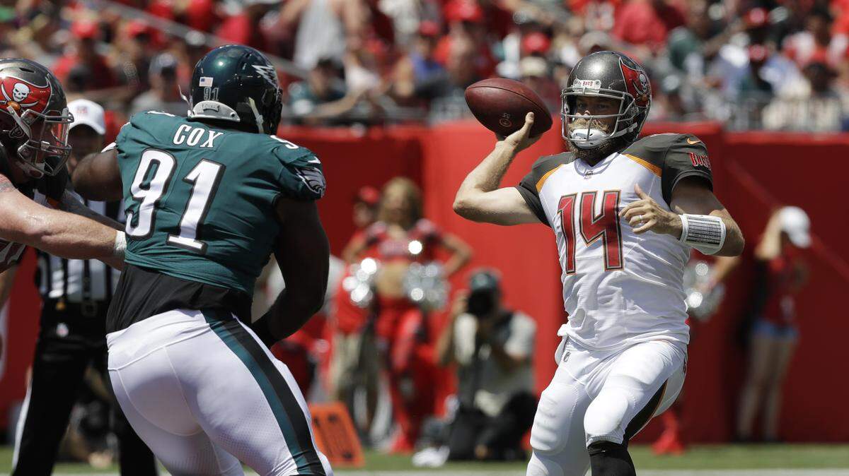 Tampa Bay Buccaneers quarterback Ryan Fitzpatrick (14) looks to pass, during the first half of an NFL football game against the Philadelphia Eagles, Sunday, Sept. 16, 2018, in Tampa, Fla.