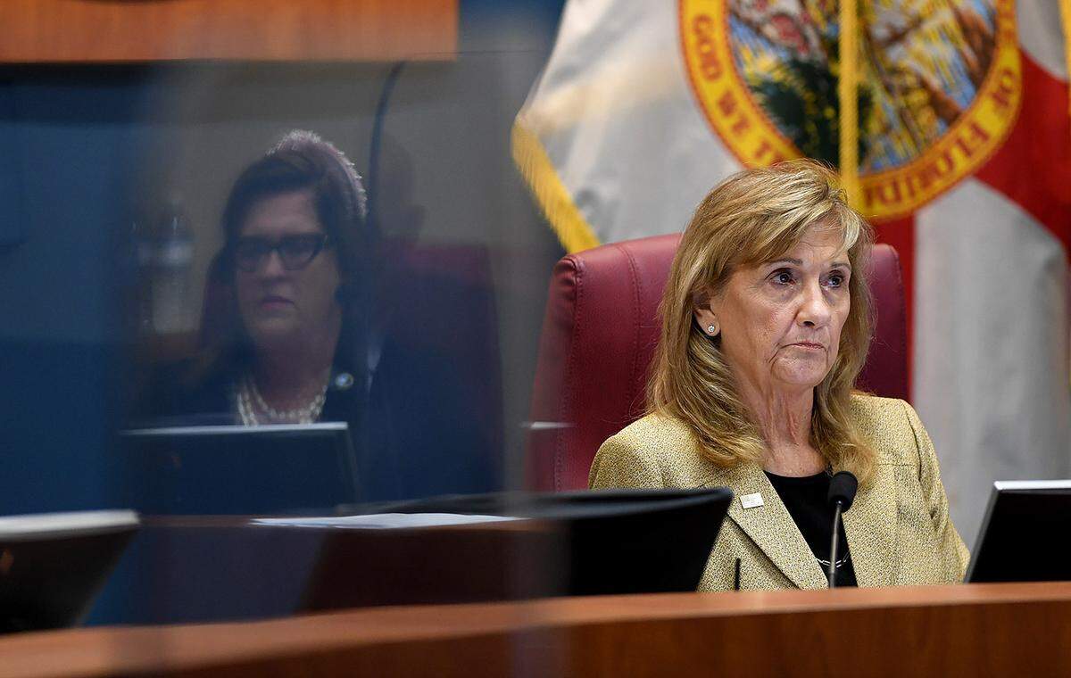 03/23/21--Vanessa Baugh listens to Misty Servia during a meeting to discuss hiring an interim county administrator.