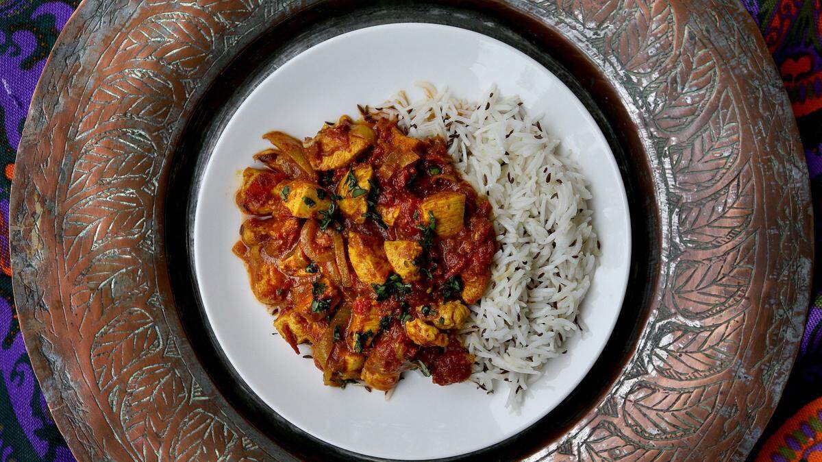 Chicken tikka masala with a side of caraway-spiced rice. (Patrick Farrell/Miami Herald/TNS)