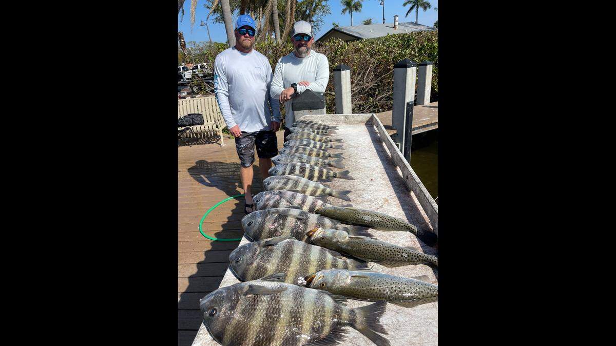 Dusty Marshall and Paul Horning pose with sheepshead caught Friday with Capt. John Gunter in Tampa Bay using Sheepballs and shrimp.