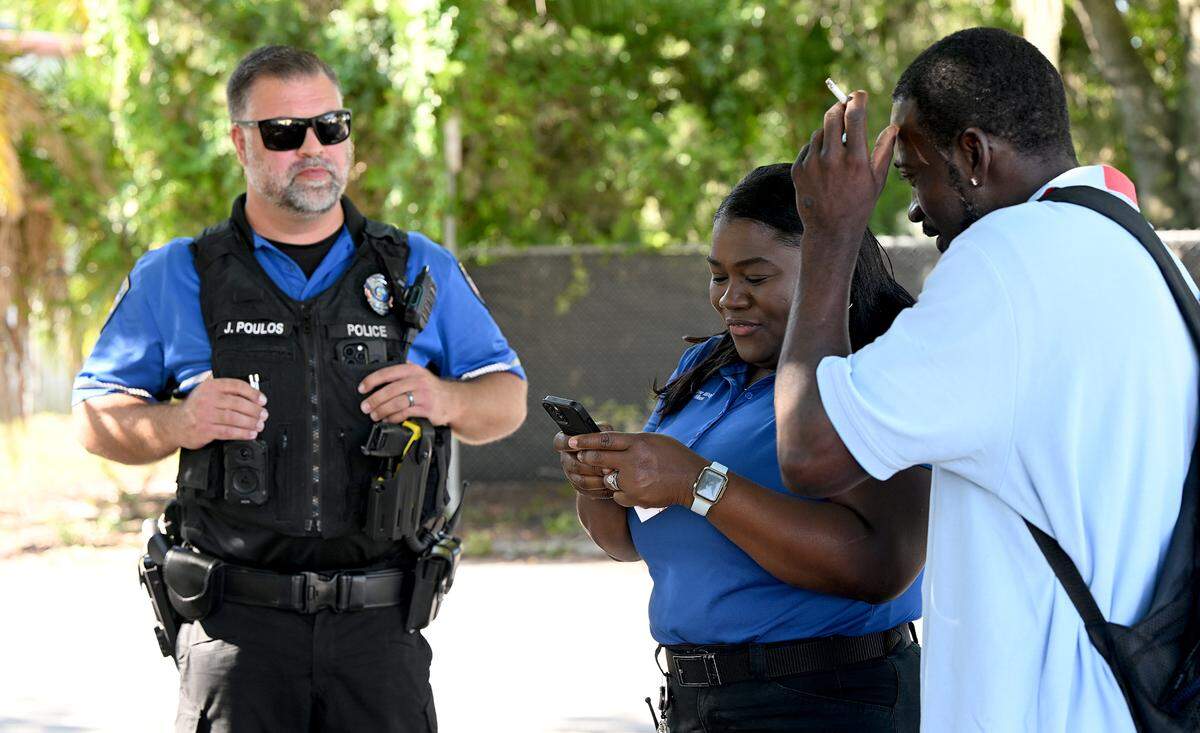 Bradenton Police officer Jordan Poulos works with Manatee County EMS case worker Tameka Foster Wilson as part of a homeless outreach team to build relationships with locally unhoused people and connect them with services and resources.