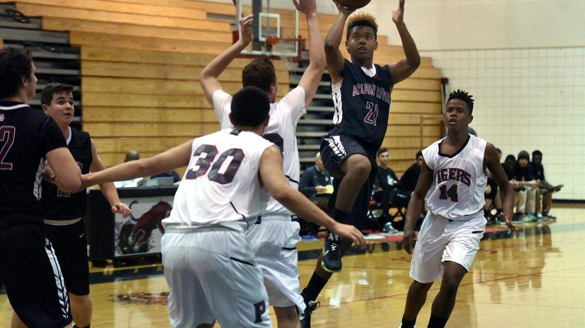 Braden River's Jordan Curtis leaps for a basket in Friday night's game at Palmetto. 
 TIFFANY TOMPKINS-CONDIE/Bradenton Herald