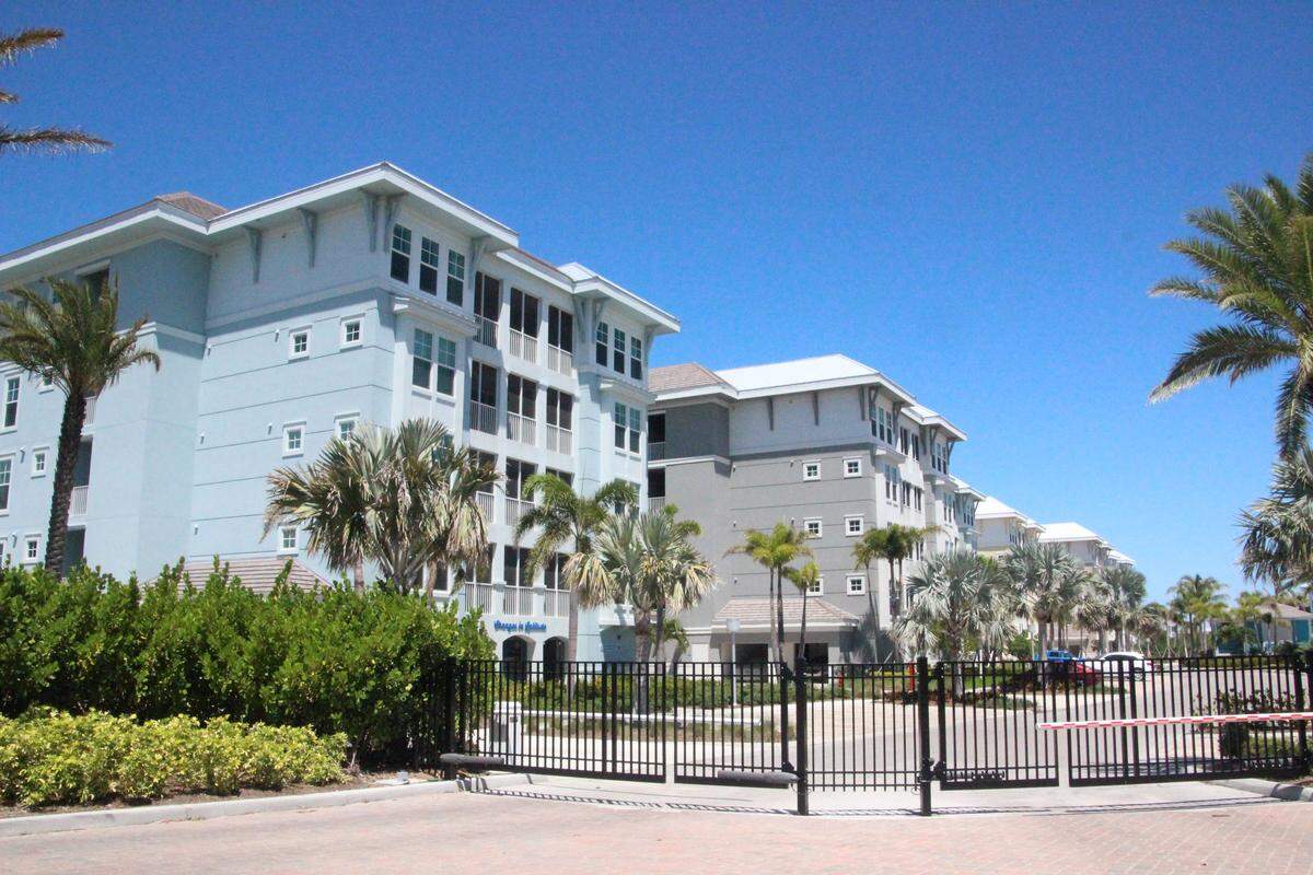 About half of the 686 units planned for Harbour Isle have been sold. Plans to add a 130-room hotel and Landshark Bar & Grill were announced Tuesday.
