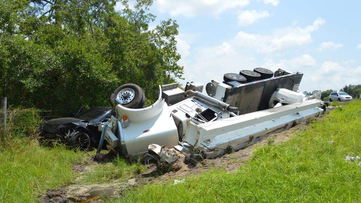 Florida Highway Patrol says a crane truck overturned on I-75 at mile marker 217 in Manatee County Thursday afternoon after losing tire pressure and colliding with a Land Rover.