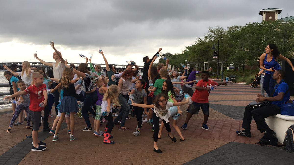 At right, Leymis Bolanos Wilmott, the artistic director of Sarasota Contemporary Dance, and drummer/dancer Jahrel Thompson, lead a Water Dance rehearsal on Bradenton's Riverwalk.PROVIDED PHOTO