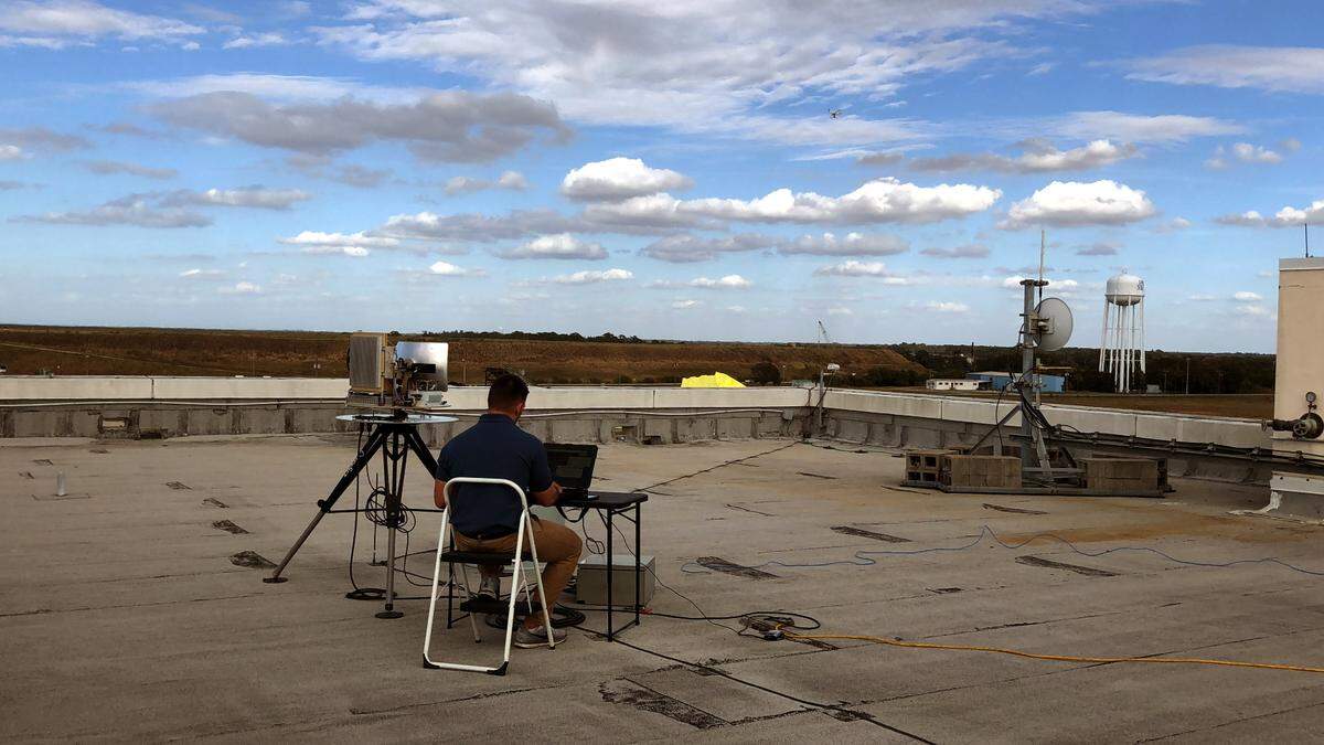 A DMT Radar & Security Systems technician test-flies a drone over Port Manatee from his perch atop the Port Manatee Intermodal Center.