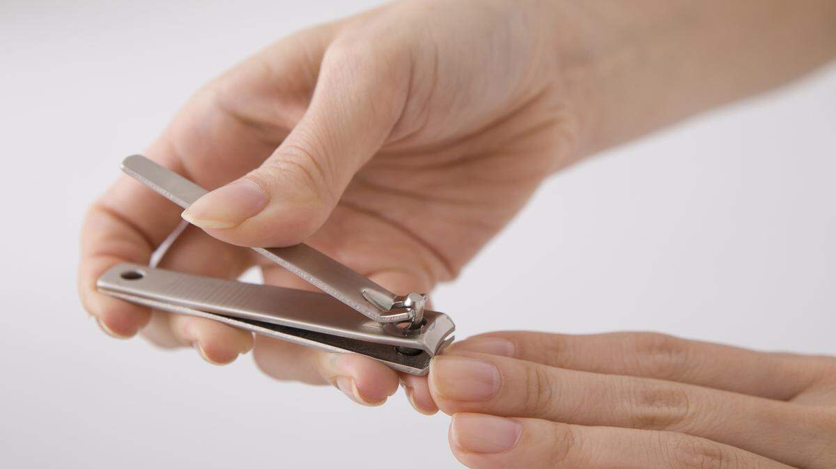 If you have a hangnail, carefully clip it off instead of pulling. Keep your nails neatly trimmed and round the tips in a gentle curve. Fotolia