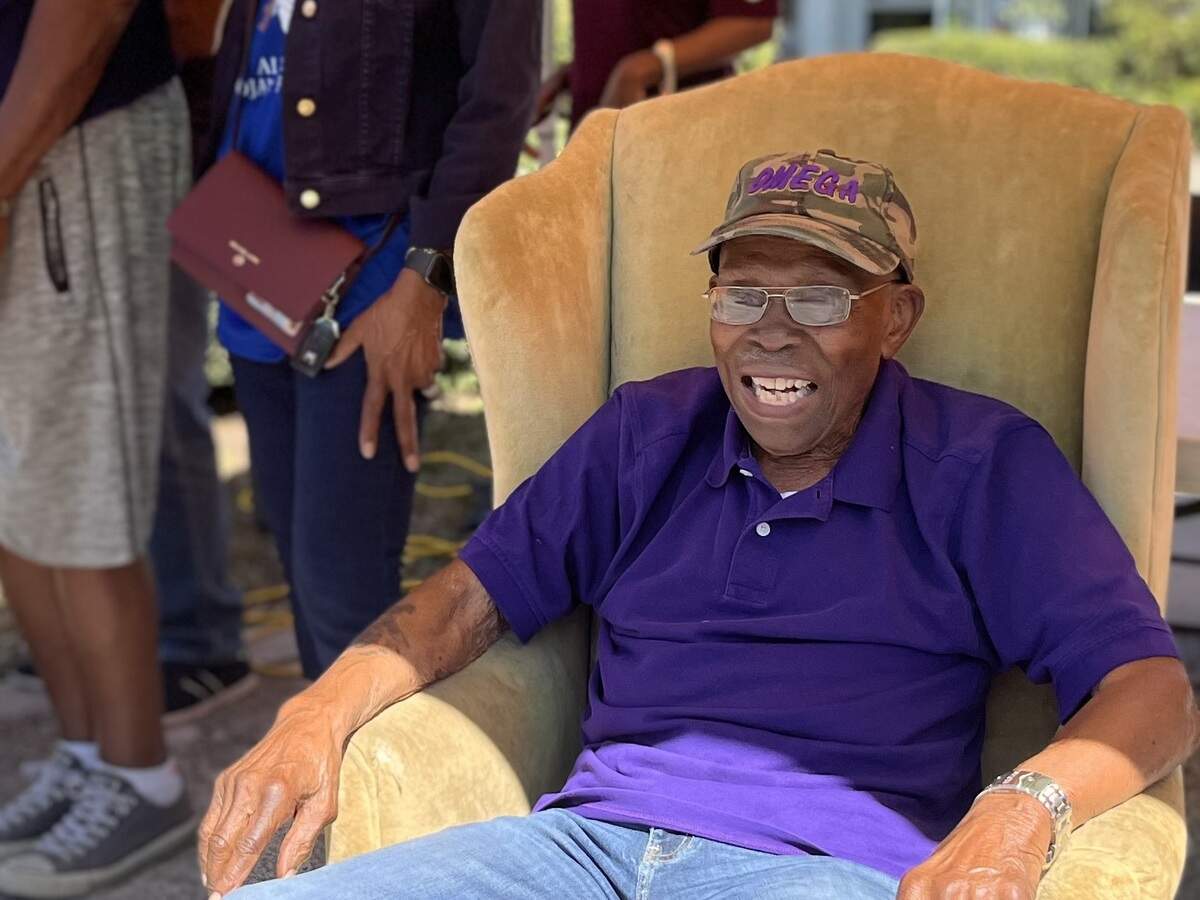 Coach Eddie Shannon all smiles during drive-by party in Palmetto to celebrate his 100th birthday in this March 2022 Bradenton Herald file photo.