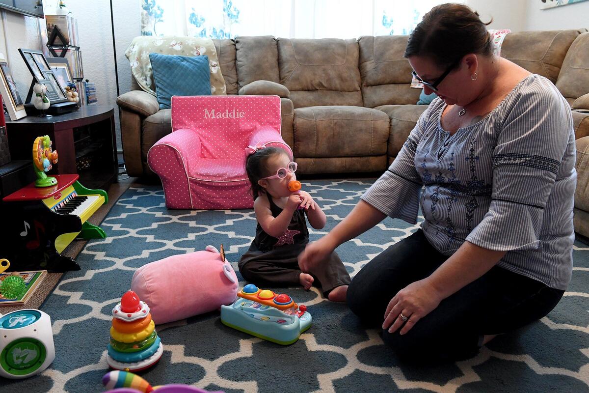 Maddie Gordon, 2, plays with her favorite toys as mom, Kristin, plays too. Maddie’s pediatric therapy program at Blake Medical will soon be moving to Manatee Memorial Hospital.