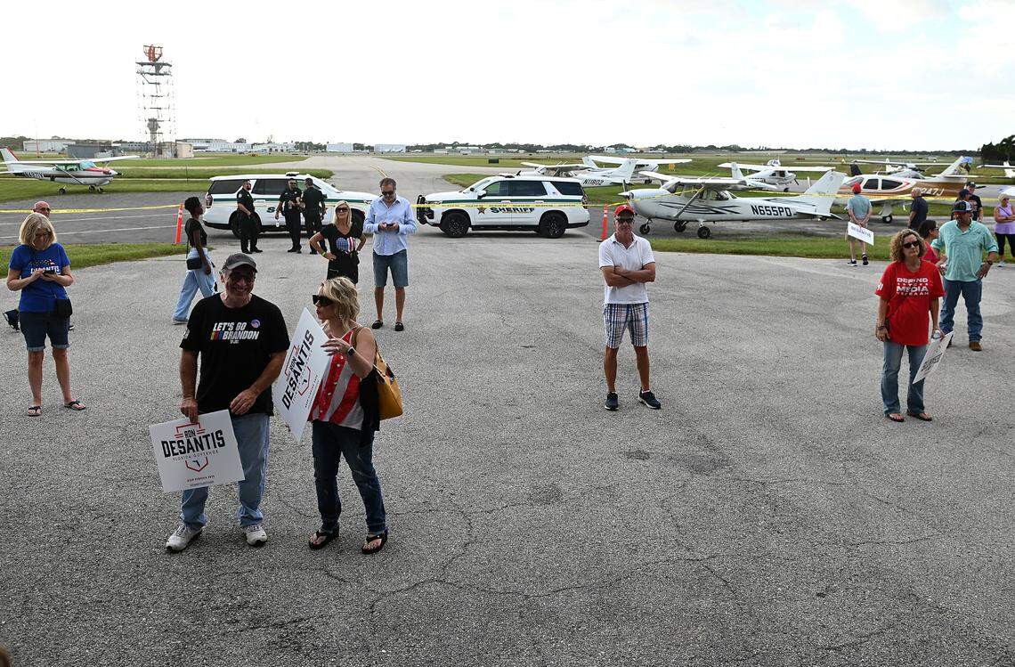 Behind the crowds, a few supporters enjoy cooler air just outside the hangar where Governor Ron DeSantis took to the stage during his Don’t Tread on Florida Tour in Sarasota November 6. DeSantis held rallies around the state leading up to Tuesday’s midterm election where he is running against former Gov. Charlie Crist.