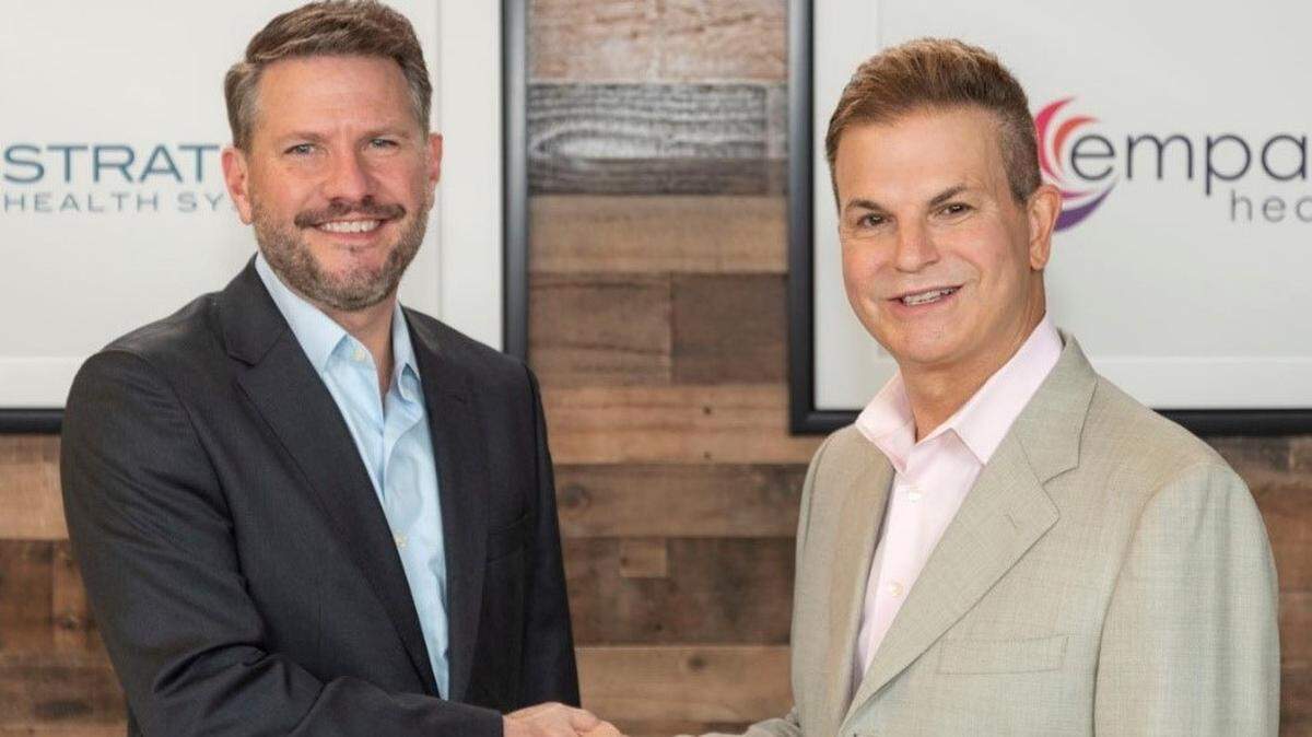 Stratum President and CEO Jonathan Fleece, left, and .Rafael Sciullo, Empath Health president and CEO, announced Wednesday that merger discussions have started between their two hospice organizations.