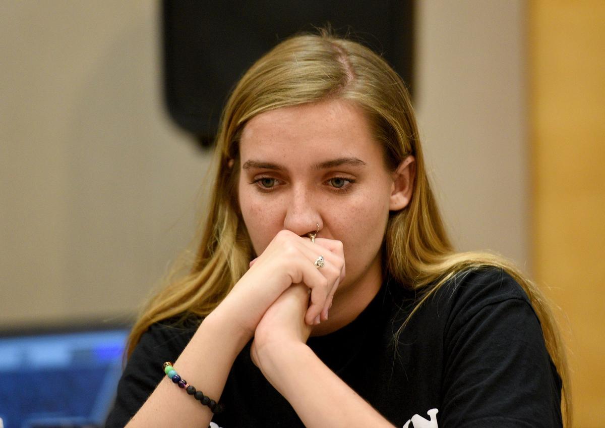 Students from Marjory Stoneman Douglas joined local student activists at a town hall meeting in Sarasota at Selby Library Wednesday. Sarasota student Katy Carthidge listens to a fellow speaker.