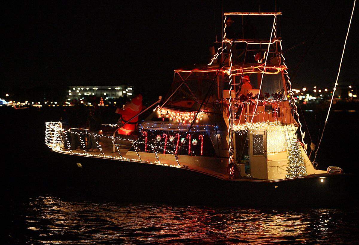 A decorated boat travels down the Manatee River during the annual holiday boat parade.