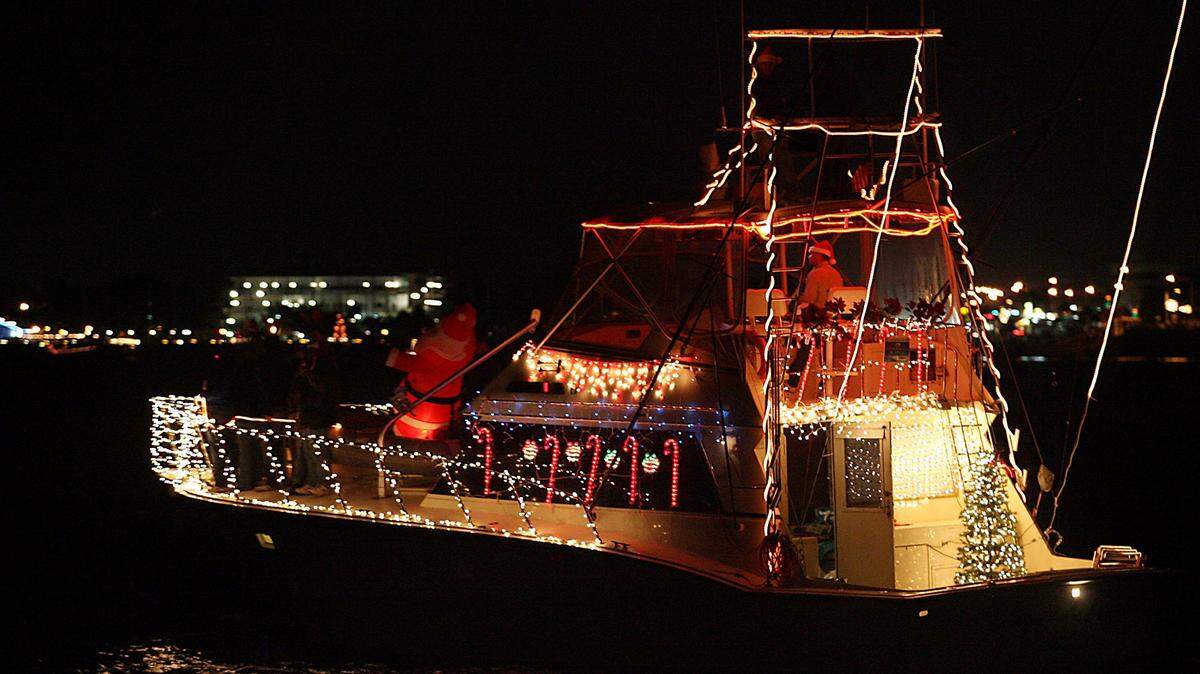 A decorated boat travels down the Manatee River during the annual holiday boat parade.