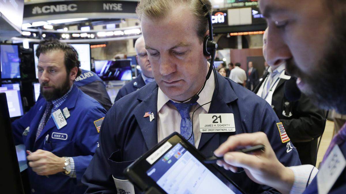 Traders monitor stock prices at the New York Stock Exchange, Friday. U.S. stocks plunged again on Friday, completing the worst two-week start to a year ever. AP Photo/MARK LENNIHAN