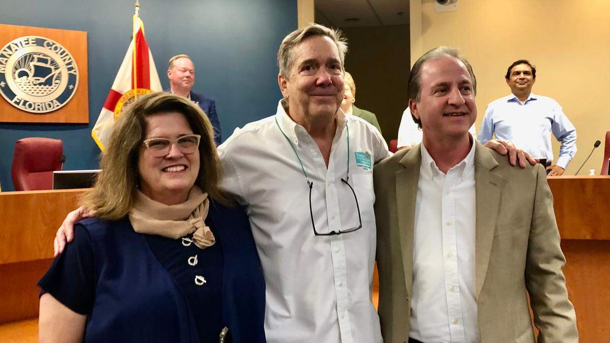 06/21/2021--Ed Chiles, center, was recognized Monday for his 25 years of volunteer service on the Manatee County Tourist Development Council. Also shown are council chair Misty Servia and Elliott Falcione, executive director of the Bradenton Area Convention and Visitor Bureau.