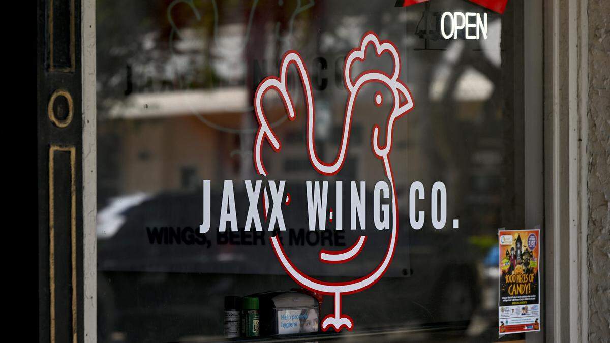 The front window sign at Jaxx Wing Co. on Bradenton’s Old Main Street in downtown Bradenton.