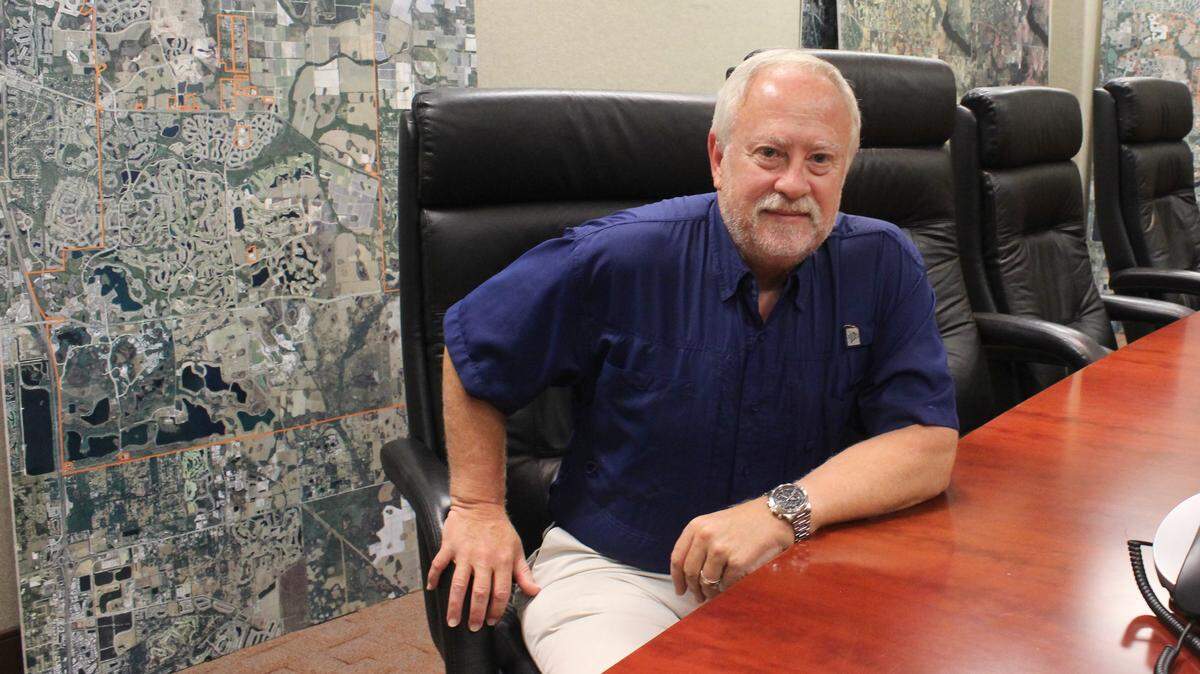 Rex Jensen, president and chief executive officer of Schroeder-Manatee Ranch, looks to the future at Lakewood Ranch. 
 JAMES A. JONES JR./Bradenton Herald