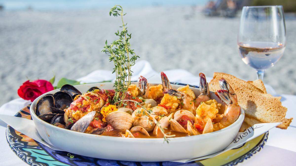 Sean Murphy has reopened Beach Bistro, 6600 Gulf Drive, Holmes Beach, seven months after the arrival of the COVID-19 pandemic. Murphy spent thousands of dollars to install anti-virus air handling and filtration systems to safely provide fine dining indoors or on the sand. Shown above: bouillabaisse.