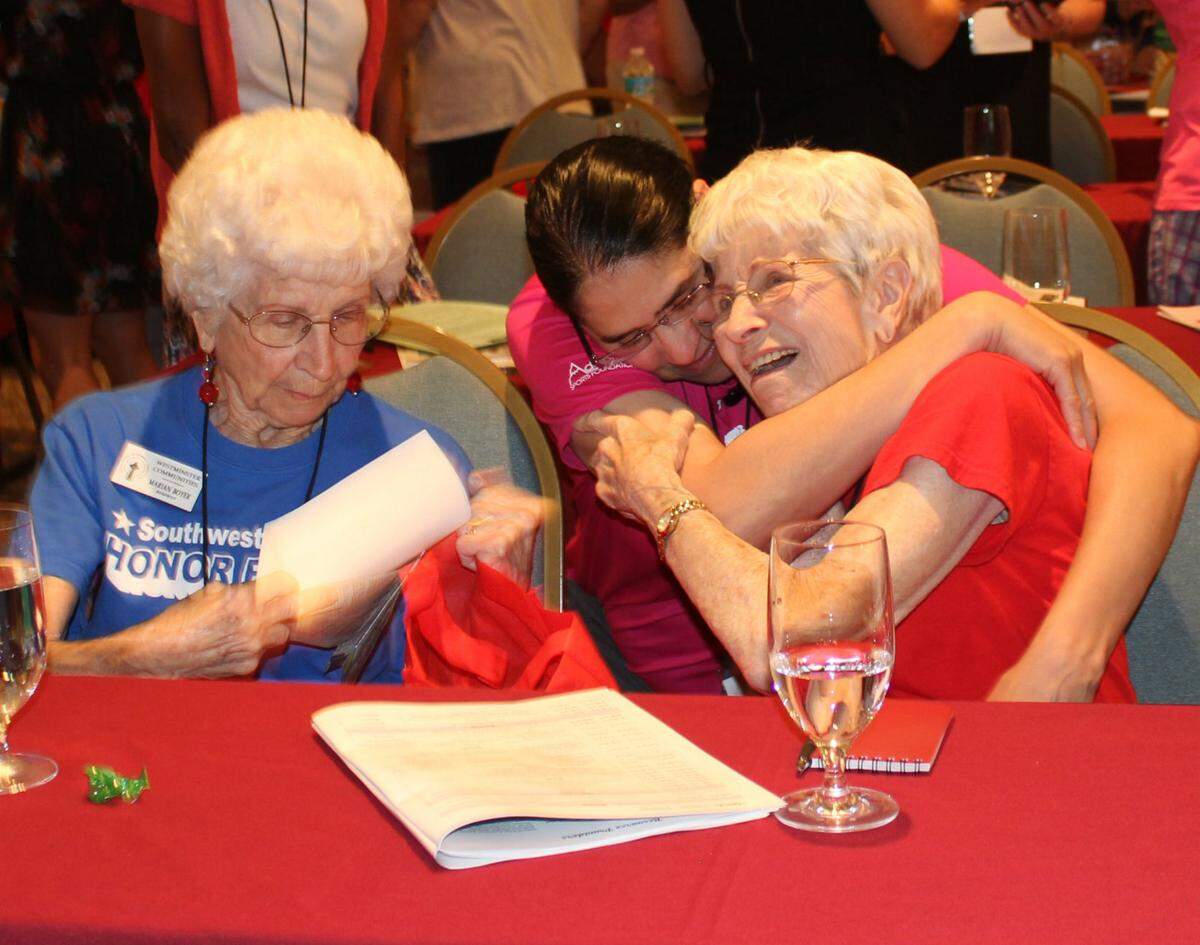 Twins Marian Boyer, left, and Millie Dost, right, of Bradenton, served as nurses in World War II. They received standing applause from others who attended the Florida Women Veterans 2015 Conference in Lido Beach. They also received a big hug from Jeanette Nieves-Ayala. Boyer served in the Navy, and Dost served in the Army.