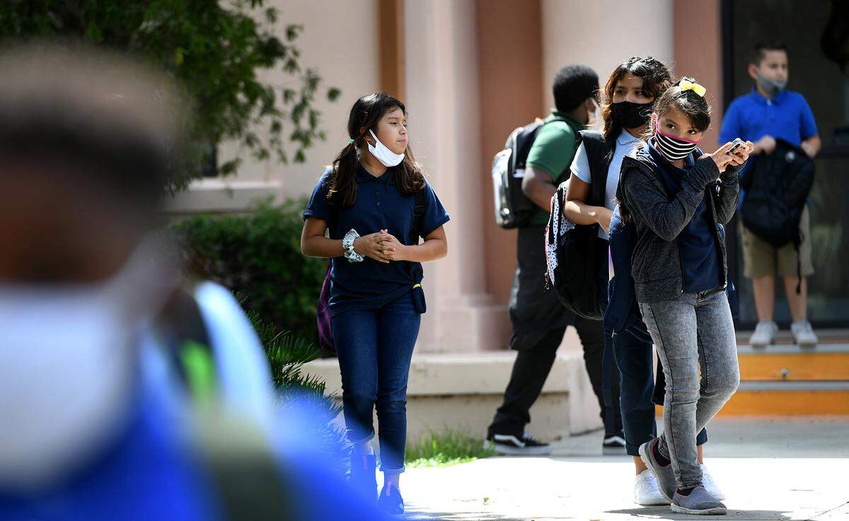 08/25/21—Students are dismissed from Ballard Elementary School on Wednesday. More than 2,400 parents answered a school district survey and said they preferred a mask-only classroom for their children.
