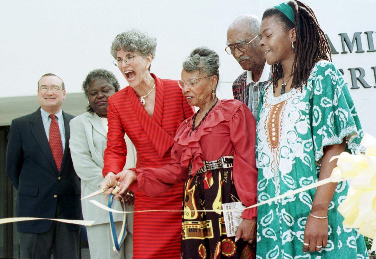 9/20/2000--Francis I. “Rip” duPont, chair Manatee Community College District Board of Trustees, Gwendolyn Brown, vice chair of Manatee County Commission, Dr. Sarah H. Pappas, Manatee Community College President, Fredi Brown and her husband Ernest Brown, founders of the Family Heritage House, and Manatee Community College student Karen John, all sharing in the ribbon cutting for the Family Heritage House Museum at Manatee Community College in 2000, during the museum’s grand opening celebration.