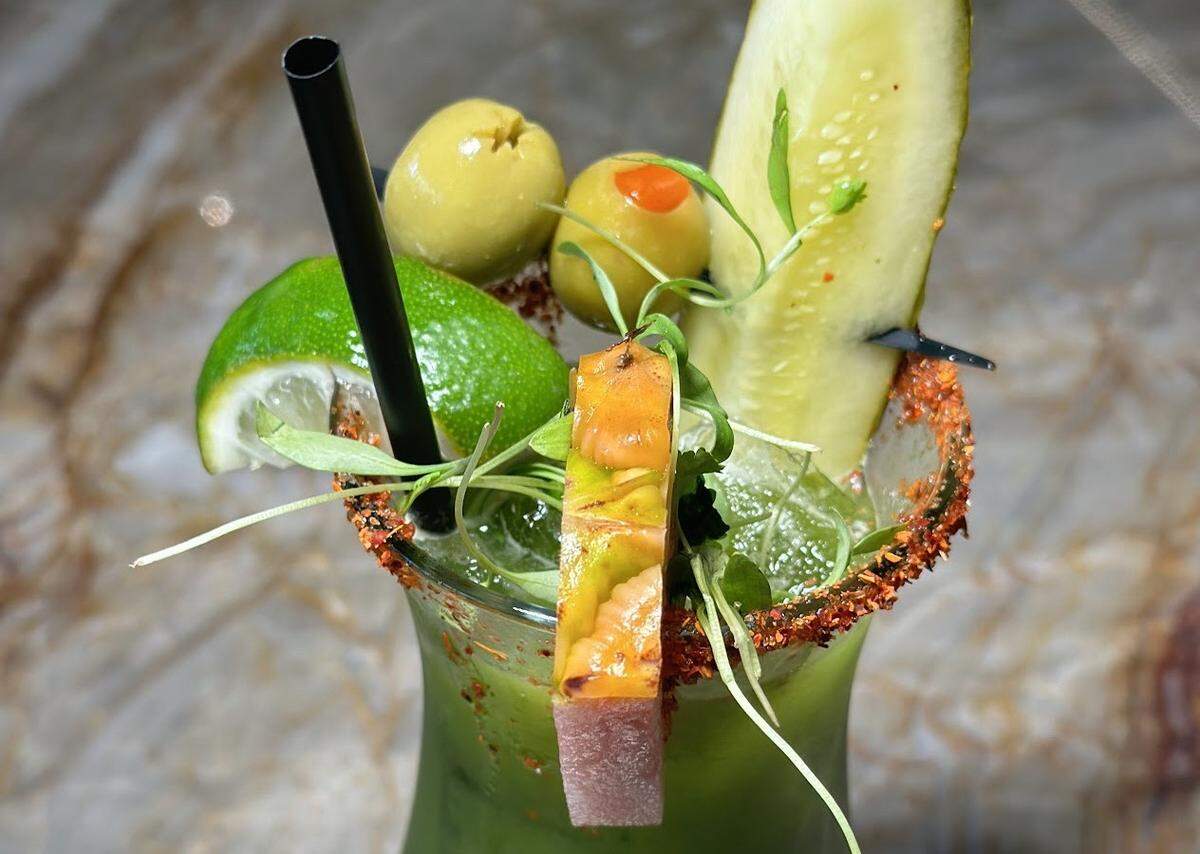 The Verde Mary, a green bloody mary made with house tequila or vodka, pineapple juice, cilantro, mint, jalapena and olive juice.