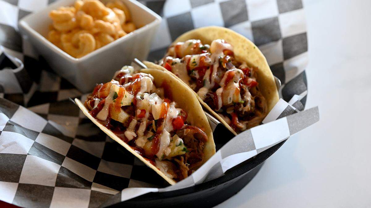 Island tacos with pulled pork, cole slaw, bbq sauce, southwest sauce, pineapple salsa on either corn or flour tortillas at Pork Belly’s, 9516 Cortez Road West.