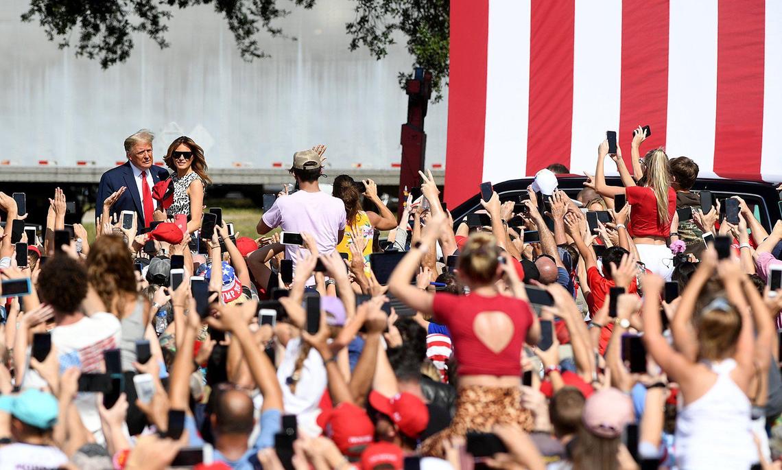 President Trump and First Lady Melania arrive for a rally in a parking lot at Raymond James Stadium in Tampa October 29.
