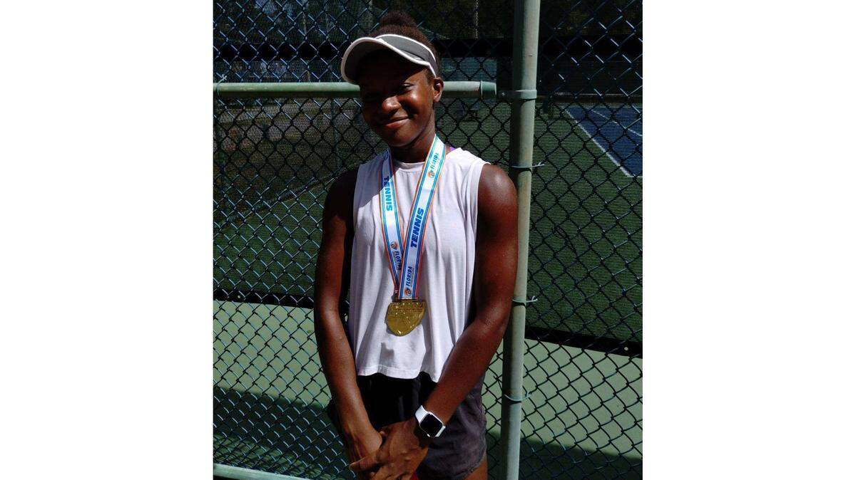Braden River freshman Chukwunoneeru Smarty poses with her gold medal after winning the FHSAA Class 3A individual girls tennis state championship in Altamonte Springs on Thursday, May 2, 2024.