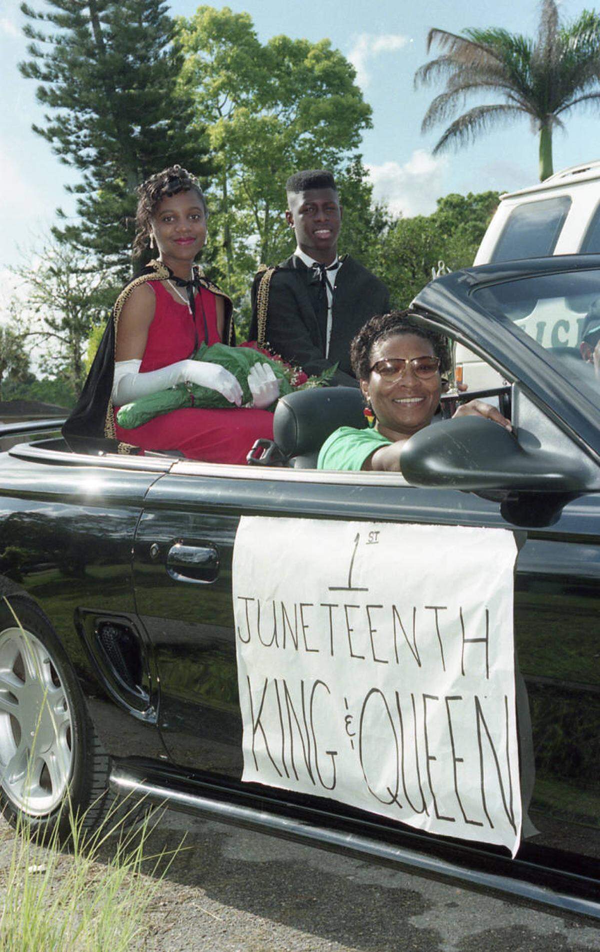 Yatesha Isom, selected as the inaugural Bradenton Juneteenth Celebration Queen rides atop a Mustang with King Kenjy Yates in 1996. The Bradenton Herald covered the event and images from that day have been preserved by Manatee County Public Library.