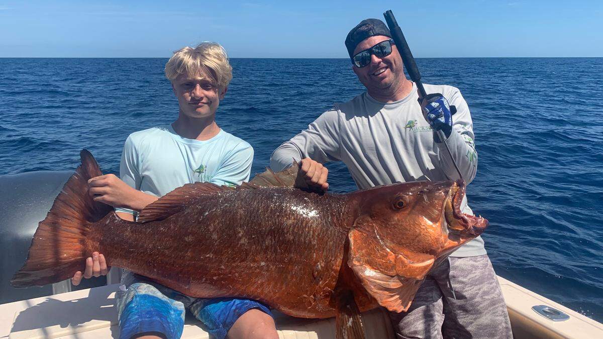 Lance Jackson, left, and his father Craig Jackson with an 86-pound cubera snapper that could end up in the International Game Fish Association record book as a world record in the 20-pound line class and for a catch by a junior.