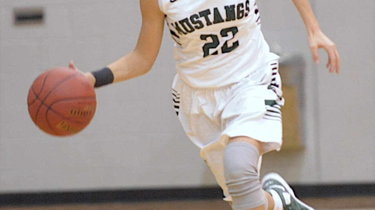Lakewood Ranch High School's Kyra Klarkowski dribbles down the court as the Mustangs hosted the Palmetto Tigers on Jan. 8, 2013, in Lakewood Ranch. 
 HERALD FILE PHOTO