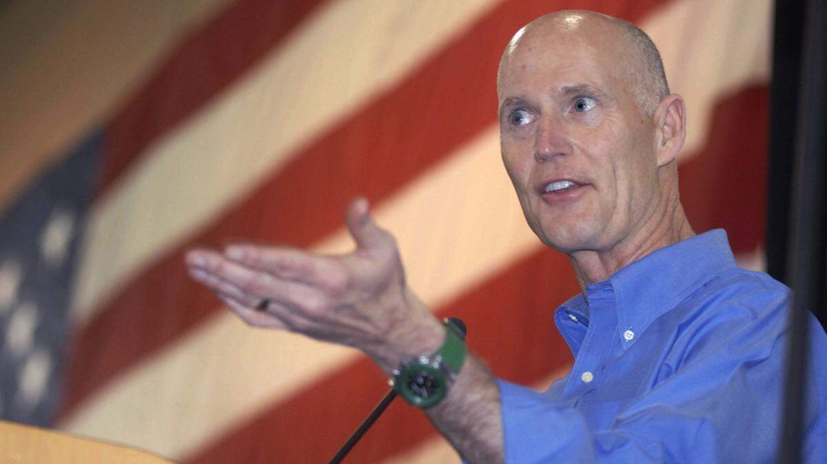 Florida Governor Rick Scott speaks to a crowd during the U.S. Constitution and Freedom Rally at the Emerald Coast Convention Center on Oakloosa Island in Fort Walton Beach, Fla., Saturday March 17, 2012. (AP Photo/Northwest Florida Daily News)
