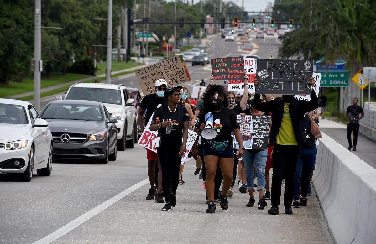 During a march called One Love, One Nation, One Heart, marchers chanted as they crossed the Green Bridge in remembrance of George Floyd. The group of about 200 made their way from Bradenton to Palmetto where they had speeches for racial justice and music.