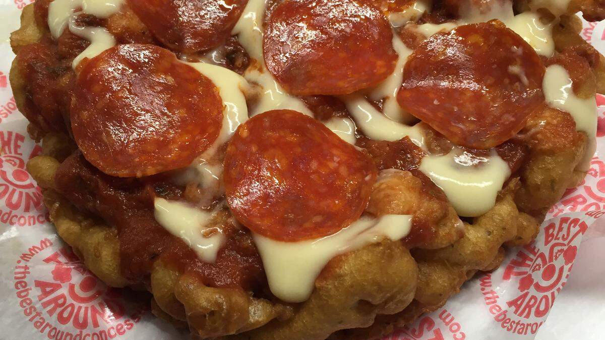 The Florida State Fair, which features food, music and Midway rides, opens today in Tampa. A pizza funnel cake is one of the new food items featured this year. 
 PUBLICITY PHOTO
