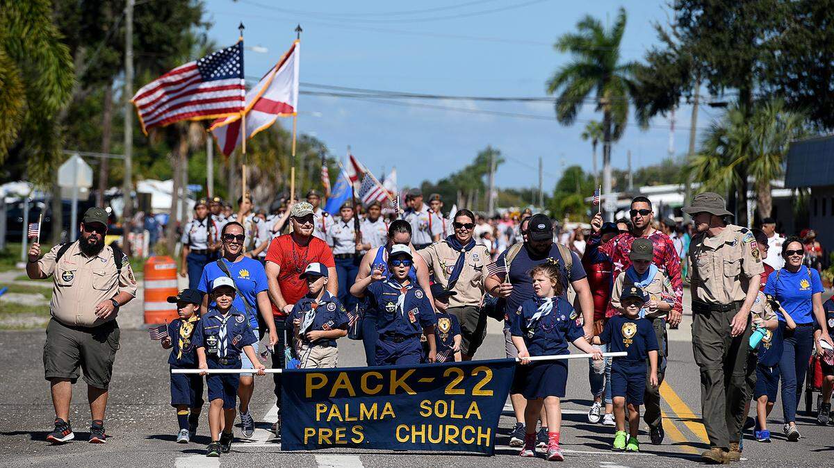 A group of Boy Scouts marches in the 2019 Veteran’s Day Parade in Palmetto. The parade returns this month for the first time since the arrival of the COVID-19 pandemic.