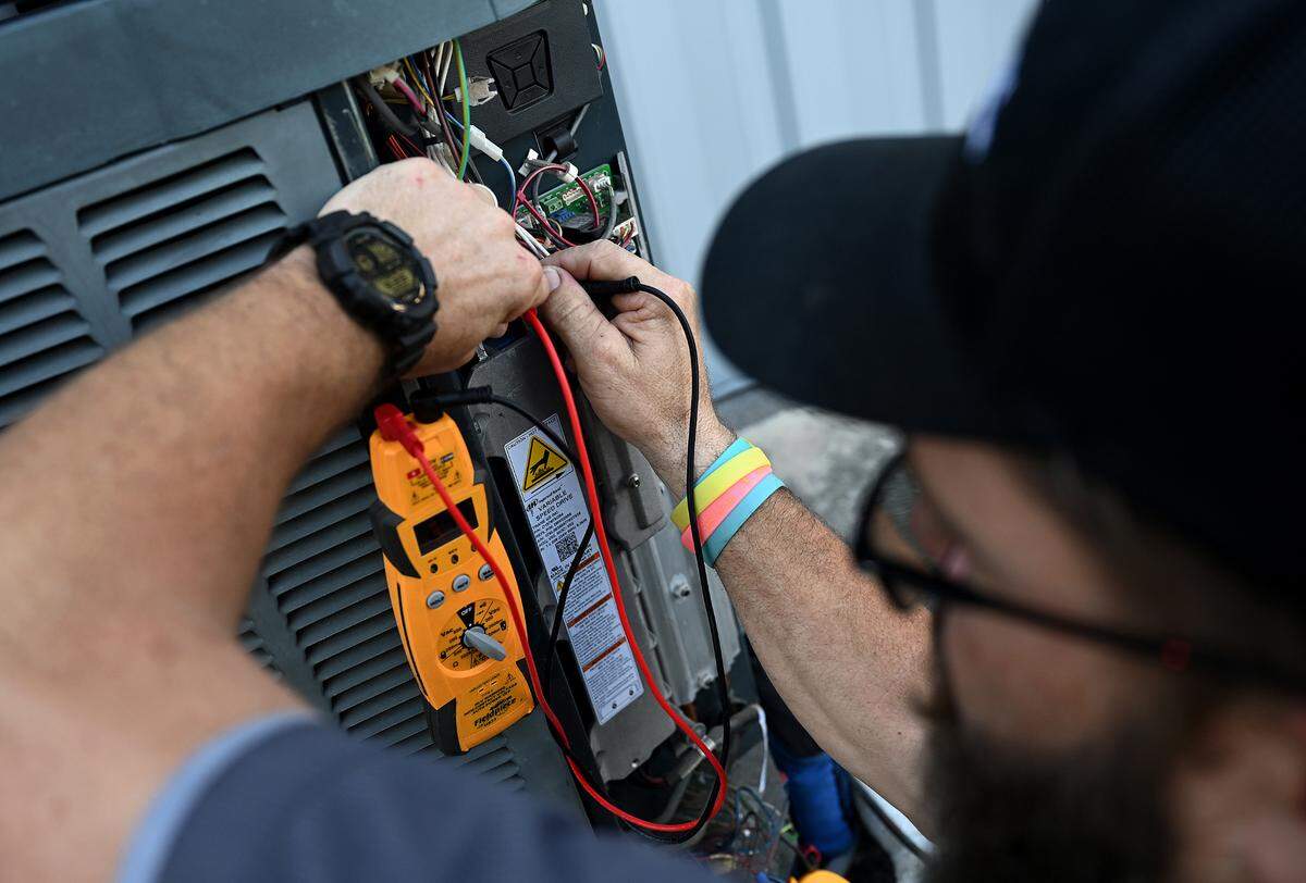 Doug Long of Air and Energy in Bradenton says he talks to his air conditioning techs about how to stay cool and safe while working in the heat.