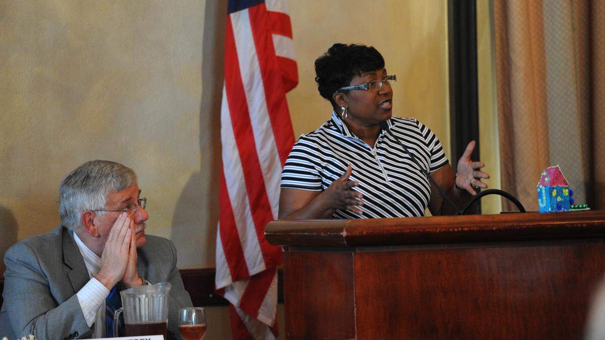 Mark Barnebey, attorney, listens as Diana Greene, superintendent of Manatee County schools, speaks about impact fees during the monthly meeting of the Manatee Tiger Bay Club in April 2016 at Pier 22. FILE PHOTO
